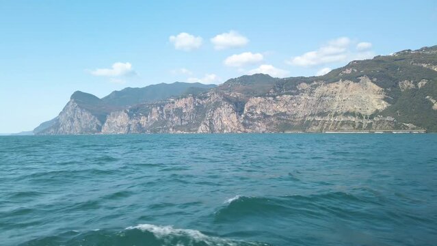 Sailing towards Malcesine in Garda lake in Italy