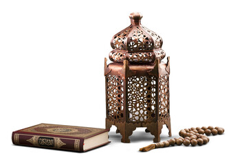 Islamic Holy Book Quran with rosary beads and ornamental arabic lantern