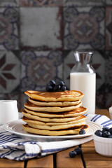 Fototapeta na wymiar Pancakes with blueberry on a wooden table