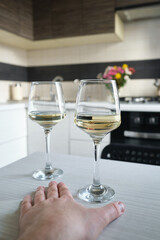 A glass of wine or champagne in the hands of a man. Tasting of alcoholic beverages. Celebrate and enjoy the moment. Glass of wine close-up
