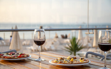 Typical peruvian food and drinks, pizza on the beach