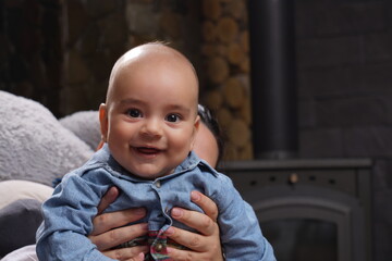 Portrait of cute baby boy smiling at home