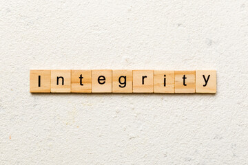 integrity word written on wood block. integrity text on table, concept