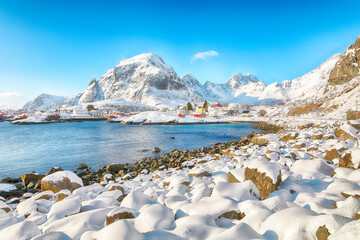Naklejka premium Attractive winter scenery of A village. Norwegian fishing village, with the typical rorbu houses .