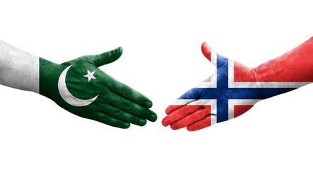 Handshake between Norway and Pakistan flags painted on hands, isolated transparent image.