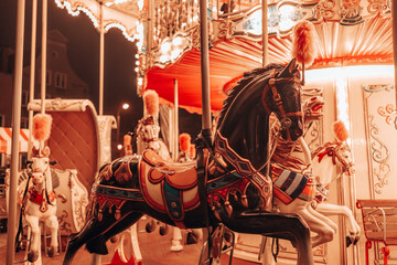  Three horses and a plane on a traditional fair carousel. Carousel with horses in Gdansk, Poland, Europe. 2024