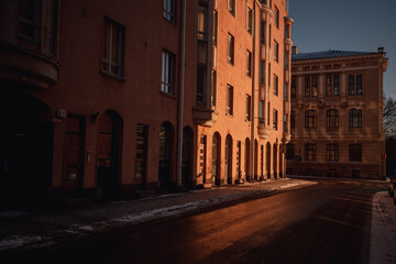 Fototapeta na wymiar sunrise over the old buildings 