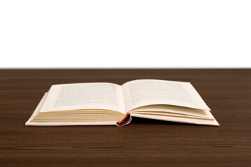 Open book on table on blurred background