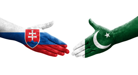 Handshake between Pakistan and Slovakia flags painted on hands, isolated transparent image.