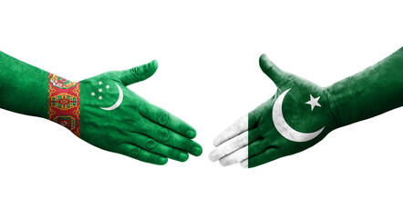 Handshake between Pakistan and Turkmenistan flags painted on hands, isolated transparent image.