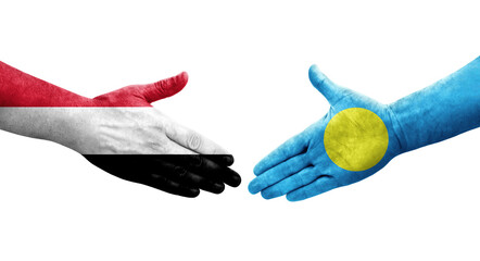 Handshake between Palau and Yemen flags painted on hands, isolated transparent image.