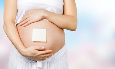 Young pregnant woman belly, baby concept
