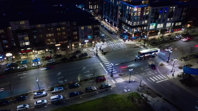 A futuristic aerial hyperlapse across the recently developed downtown of a small city.