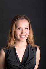 studio portrait of smiling girl