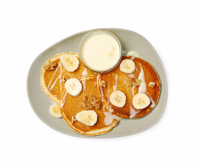 Tasty pancakes with sliced banana isolated on white, top view