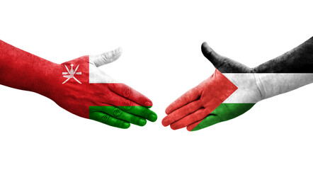 Handshake between Palestine and Oman flags painted on hands, isolated transparent image.