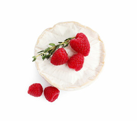 Brie cheese served with raspberries isolated on white, top view