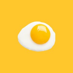 Tasty fried chicken egg on yellow background, top view