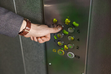 Man press button in elevator with germs, closeup © New Africa