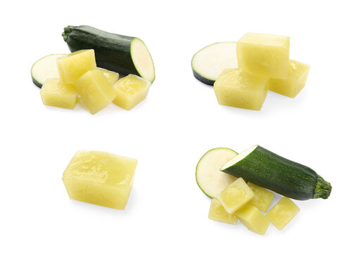 Set with frozen zucchinis puree cubes and ingredients on white background