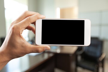 Hand of person hold phone with a blank screen