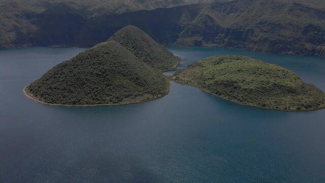 Cuicocha Lake, big lake around mountains, aerial shot of lake and volcano