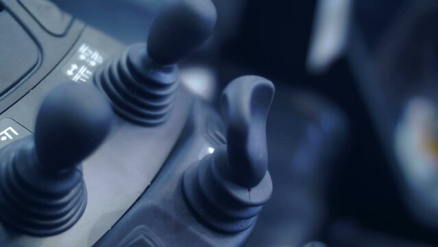 Buttons and control levers of the new modern powerful forklift. Closeup. Shallow depth of field 