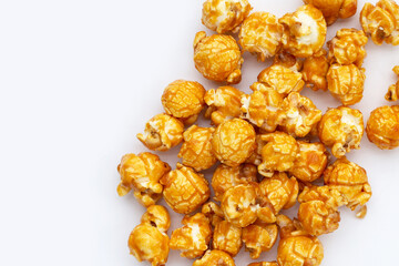 Honey caramel popcorn on white background.