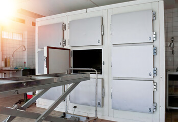 Grungy and high contrast photo of morgue trays - obrazy, fototapety, plakaty