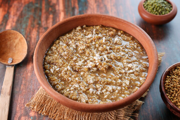 Fenugreek seeds porridge gruel soup or Uluva Kanji   navara kichadi. Monsoon Post Delivery Care Diet for lactating mothers. Health drink Kerala India. marunnu kanji Ayurveda porridge  kanji