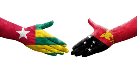 Handshake between Papua New Guinea and Togo flags painted on hands, isolated transparent image.