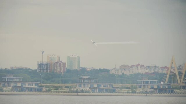 KAZAN, RUSSIAN FEDERATION, JUNE 14, 2019: Sports plane on extreme flight at the Red Bull air show, Kazan. MXS single-seat aerobatic aircraft