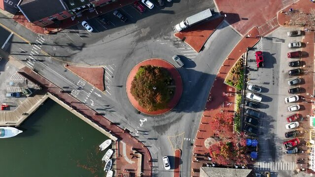 Top down aerial of traffic circle roundabout. Annapolis Maryland and Severn River during autumn.