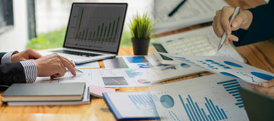 Discussion of reports displayed in charts and graphs. analyze financial statistics Take part in the overview brainstorming business people review analyze serious financial reports