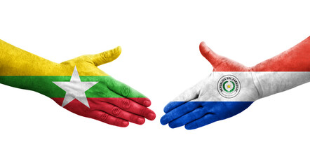 Handshake between Paraguay and Myanmar flags painted on hands, isolated transparent image.