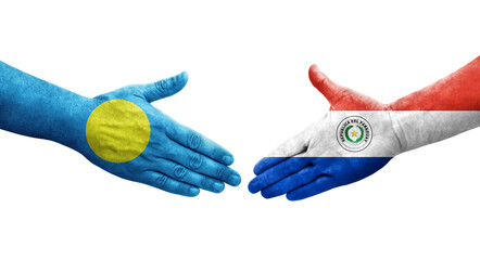 Handshake between Paraguay and Palau flags painted on hands, isolated transparent image.