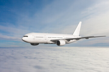 Fototapeta na wymiar White wide body passenger jet plane fly in the air above the clouds