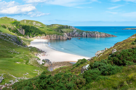 Ceannabeinne Beach and tent camping area in sunny summer weather,near Armadale,north coast of mainland Scotland,UK.