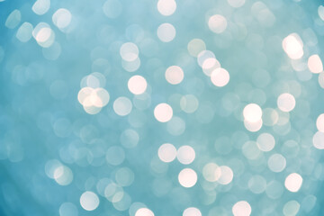 Glitter bokeh sparkle christmas festival light blue background or happy new year