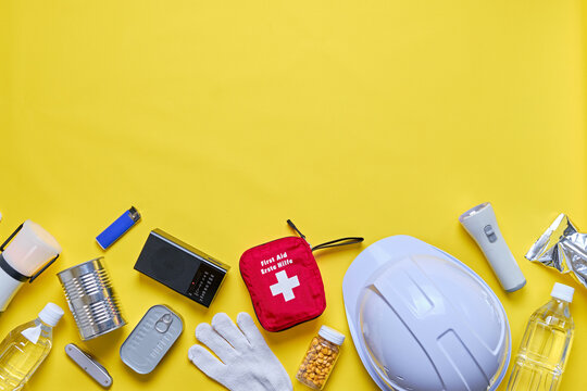 Disaster preparedness kit on yellow background.	