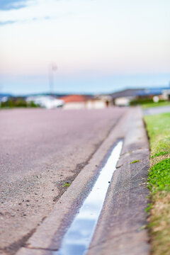 Gutter on roadside with water sitting in it - drainage issues