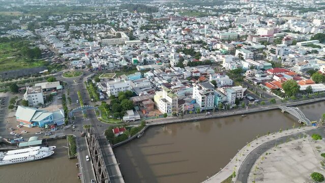 Aerial drone footage above Rach Gia coastal city in south vietnam. Drone is moving foward along the seaside to the city center 2-2