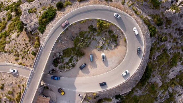 Top down aerial of cars driving on Nus de sa Corbata, Mallroca