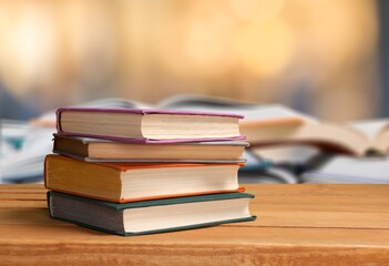 Education books set on table in library