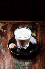 Coffee with milk on dark wooden background. Soft focus. Copy space.	