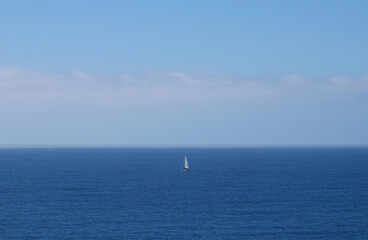 Lonesome Sailboat in the Pacific Ocean