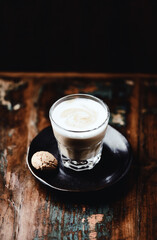 Coffee with milk on dark wooden background. Soft focus. Copy space.	