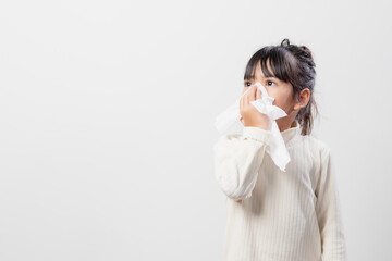 Asian child girl sick with sneezing on the nose and cold cough on tissue paper because weak or...