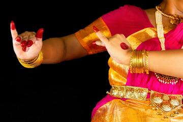 Indian Bharatanatyam classical dancer demonstrating dance mudra or gestures in traditional costume...