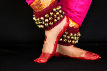 Female Indian classical dancer legs in closeup view demonstrating dance mudra or gestures of Bharatanatyam dance